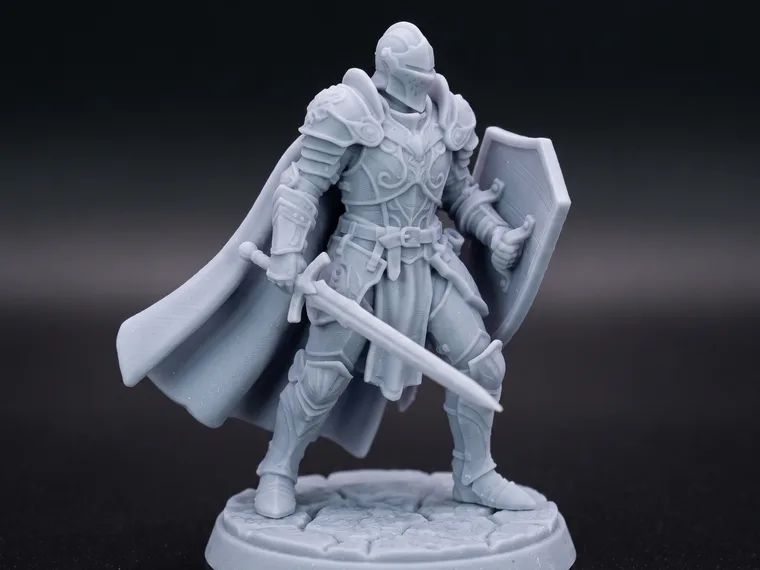 The same knight as a grey resin 3D-printed tabletop miniature standing on a round base, showing what the 3D-printable STL download produces.